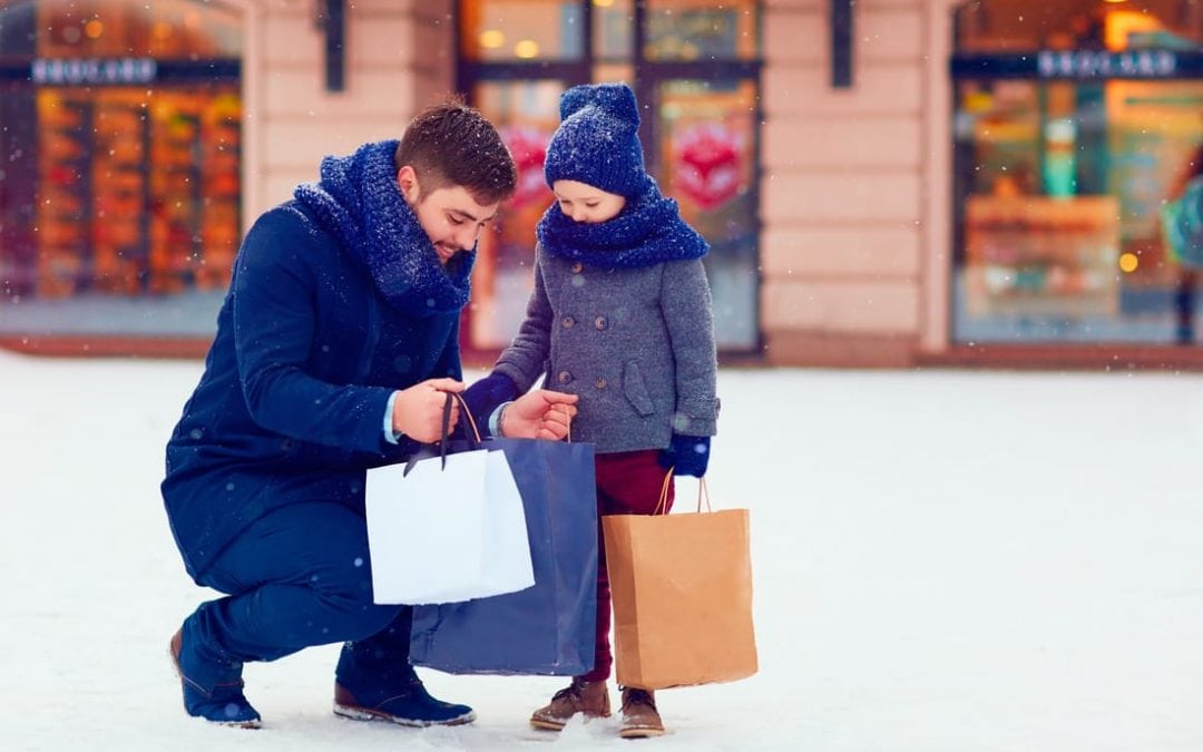 dad and kid shopping in the snow