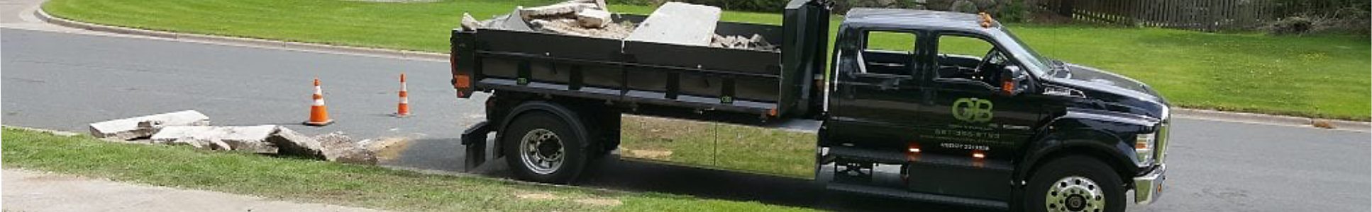 Green and Black landscaping truck