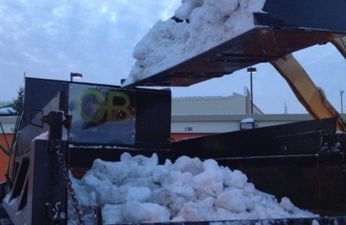 dumping snow into truck